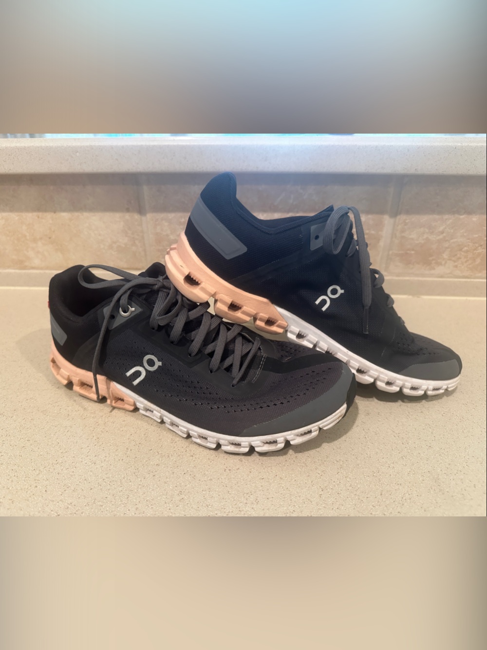 On Running Black and Peach Women's Cloud athletic shoes - see photos